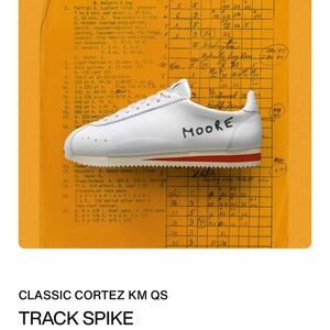 Nike White and Orange Sneakers with Sleek Design